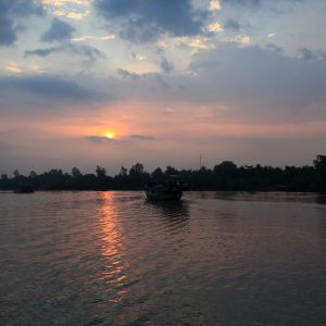 late_afternoon_boat_traffic_on_a_tributary_of_the_mekong.jpeg
