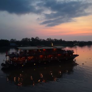 wooden_cruise_boat_in_the_early_mekong_delta_morning.jpeg